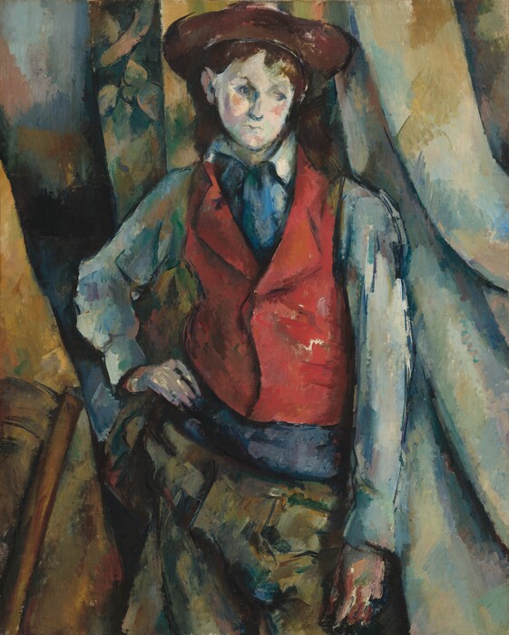 A boy in a red waistcoat leaning on one elbow, gazing down.