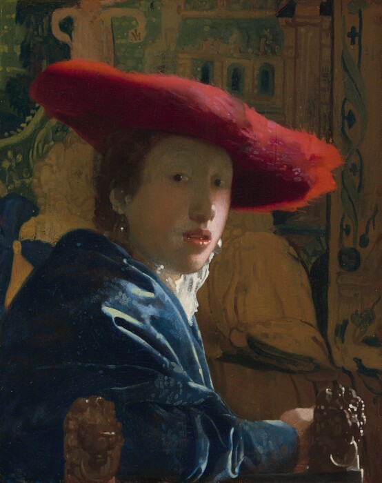 A young woman in a broad scarlet hat turning toward the viewer.